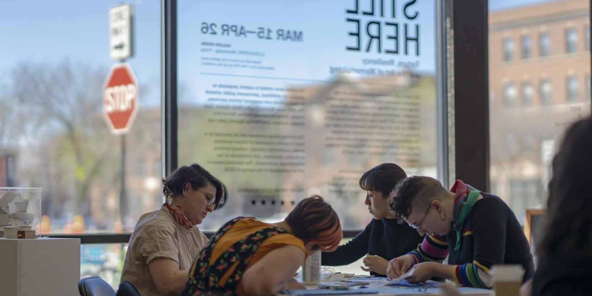 Students sitting at table