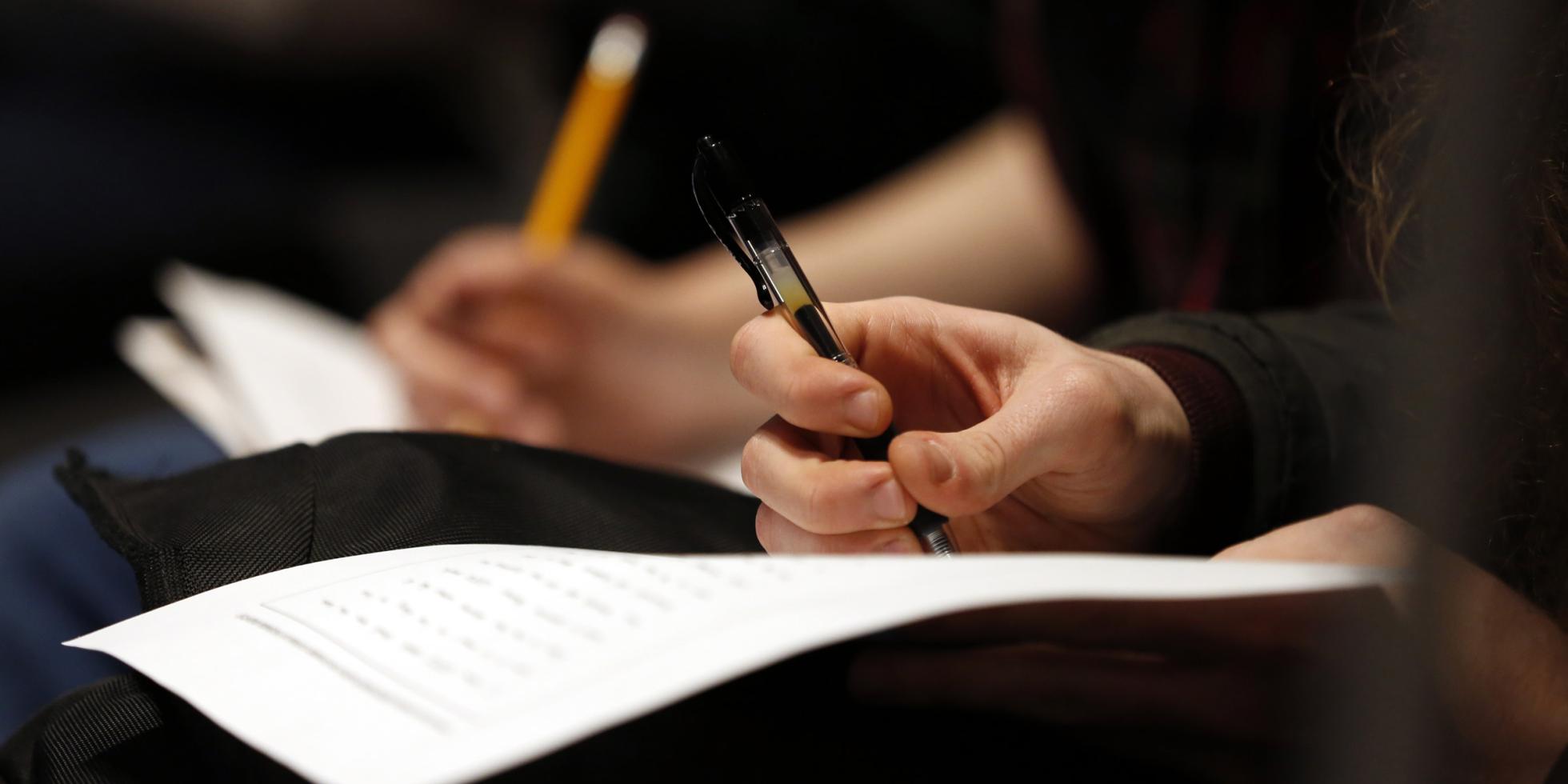 Student Hand Writing Notes