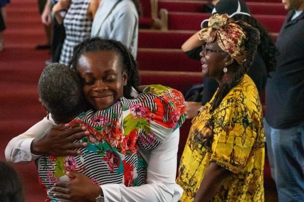 Two participants in the Human Rights Lab "Institute of Memory" sharing a hug