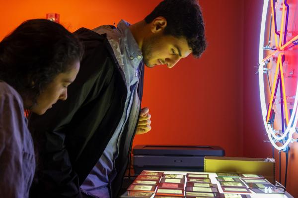 Student Looking at Art Installation